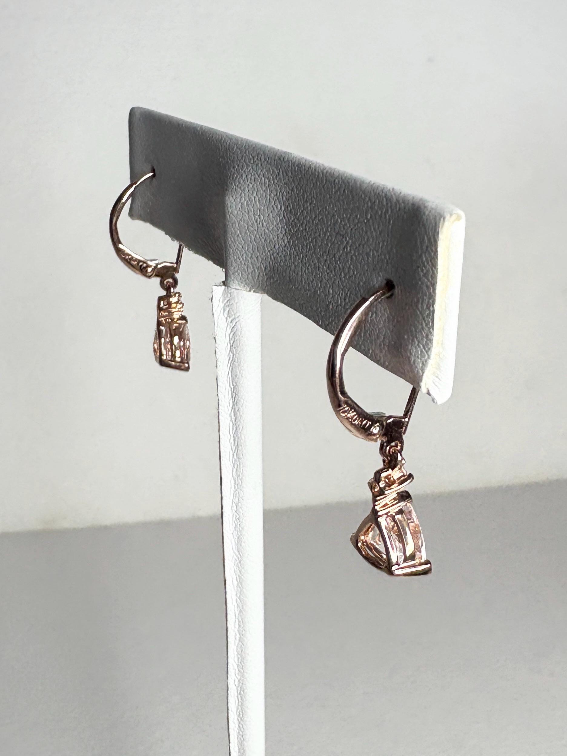 10k rose gold dangle earrings with trillion morganite and diamond accents.
