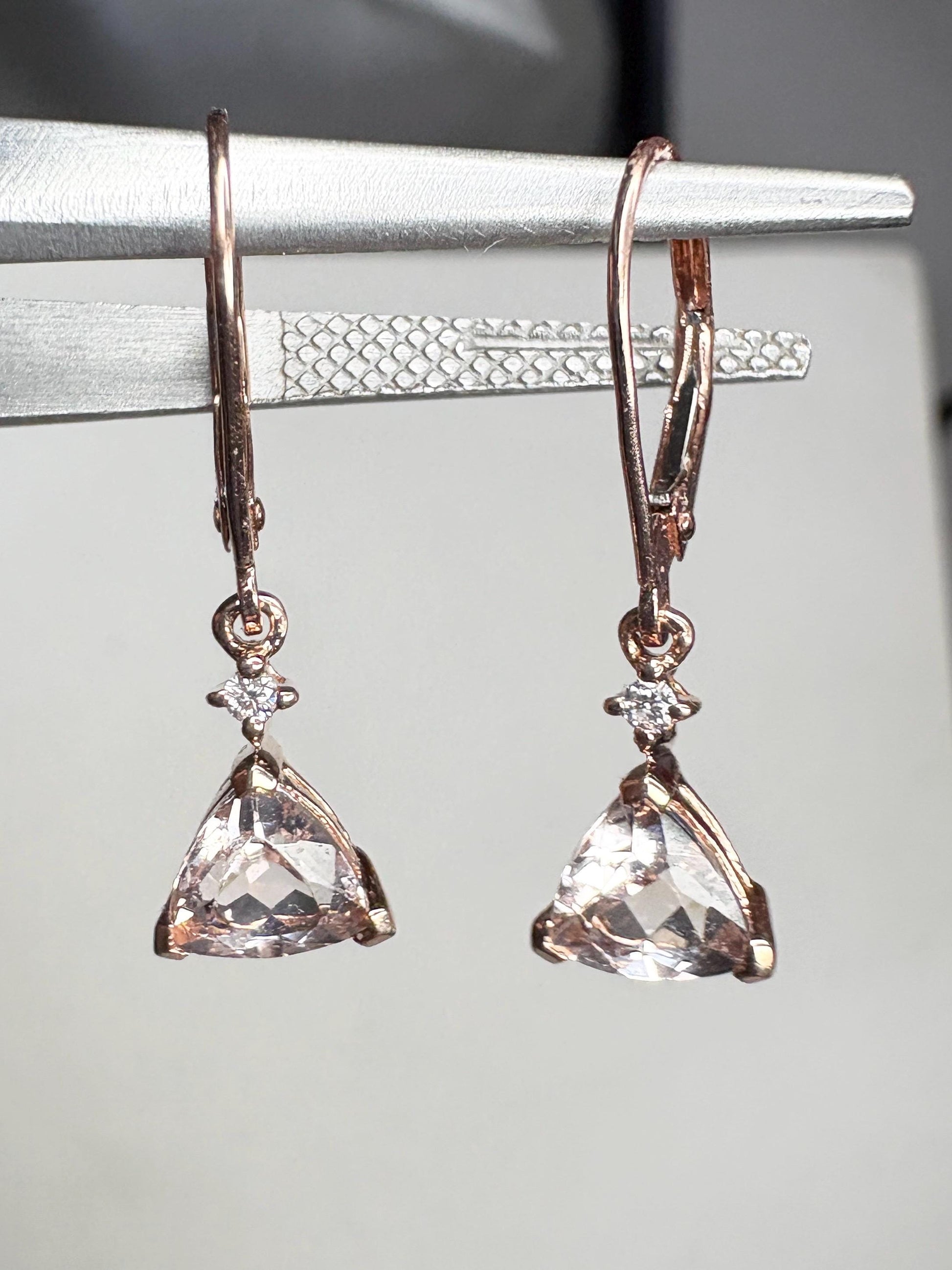 Rose gold dangle earrings with trillion morganite and diamond accents.