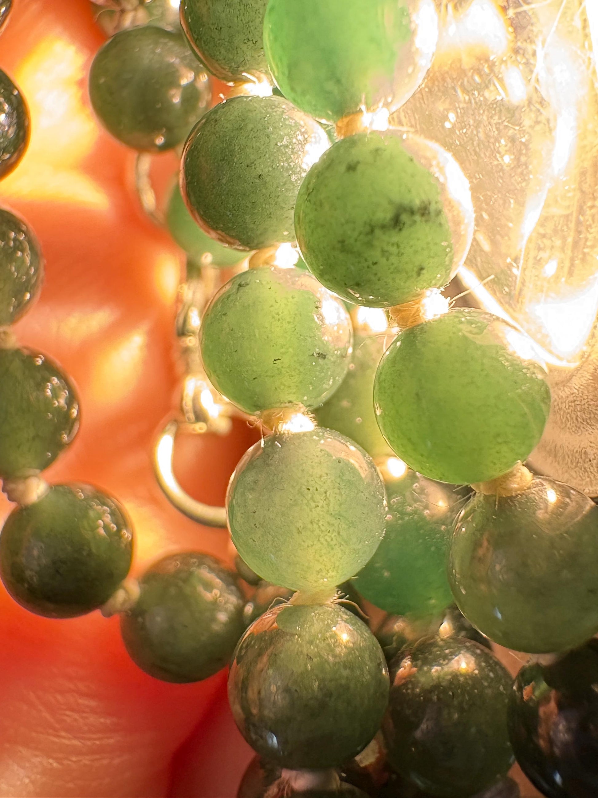 Teal Guatemalan jadeite jade beads on a 30-inch necklace with a sterling silver clasp.