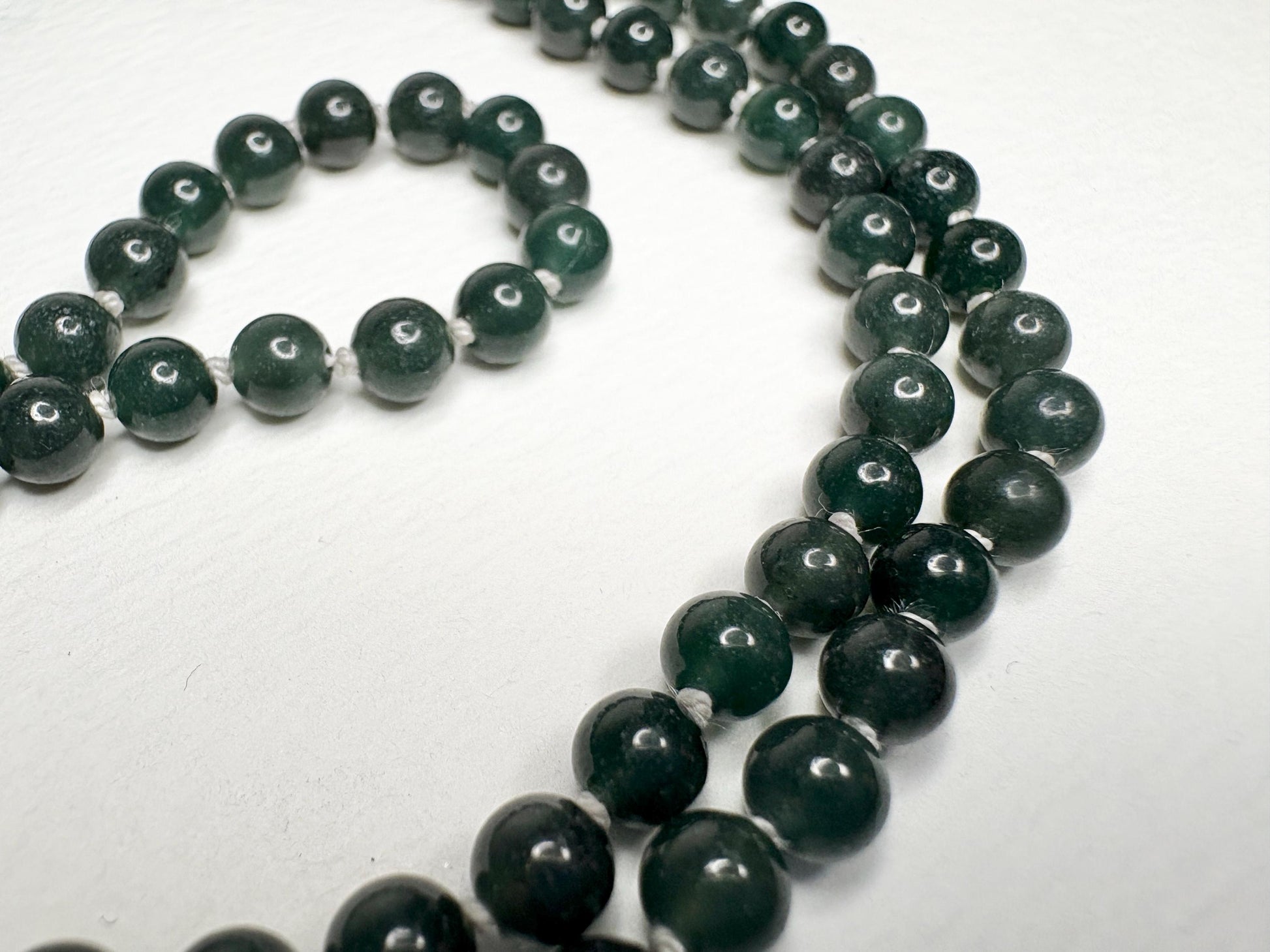 Teal jadeite jade beaded necklace with sterling silver clasp.