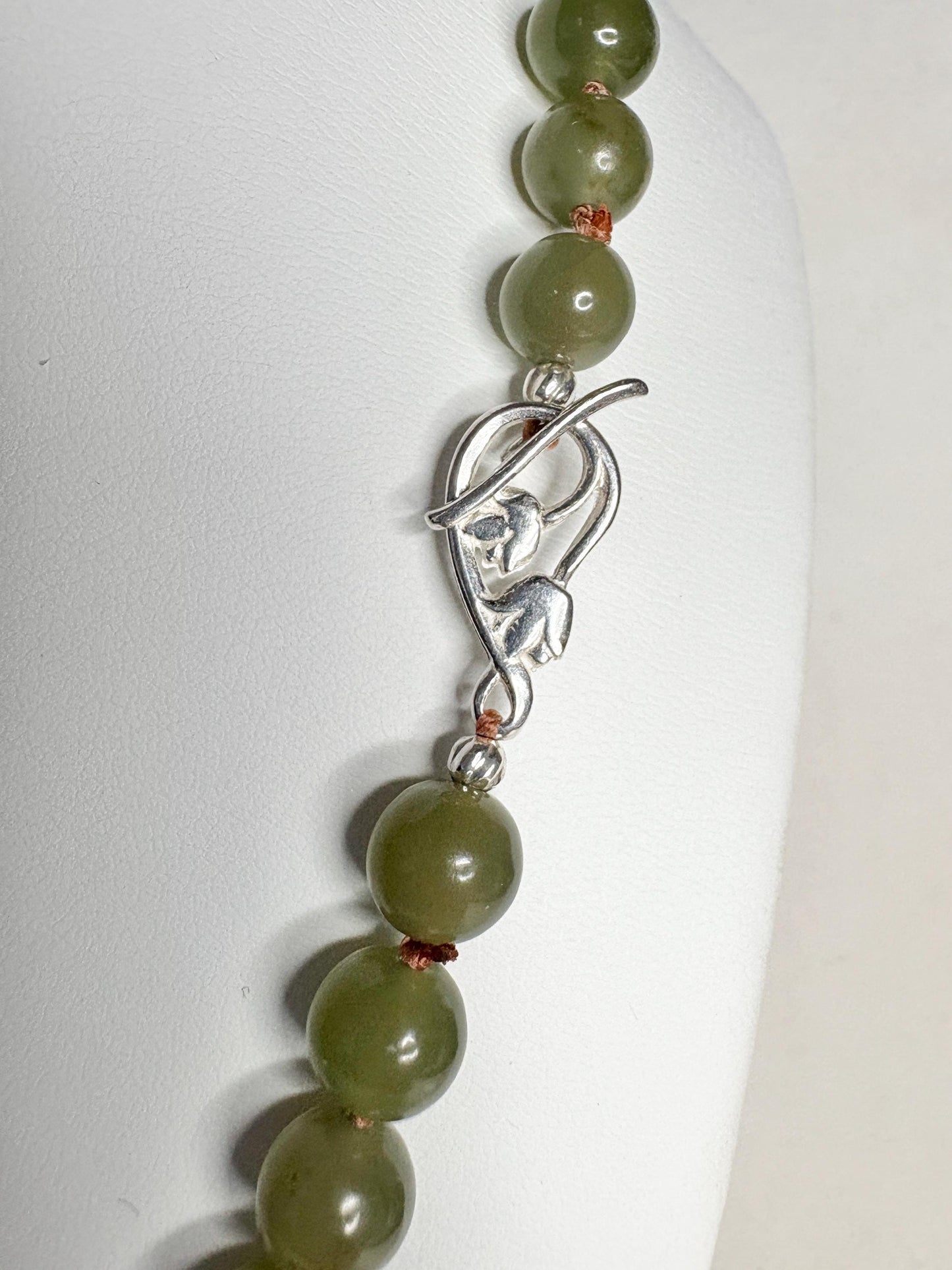 Nephrite Hetian jade beaded necklace with sterling silver toggle clasp.