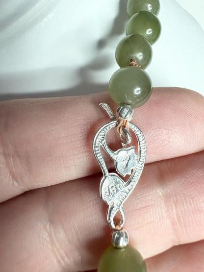 Nephrite Hetian Jade beaded bracelet with sterling silver lotus toggle clasp.