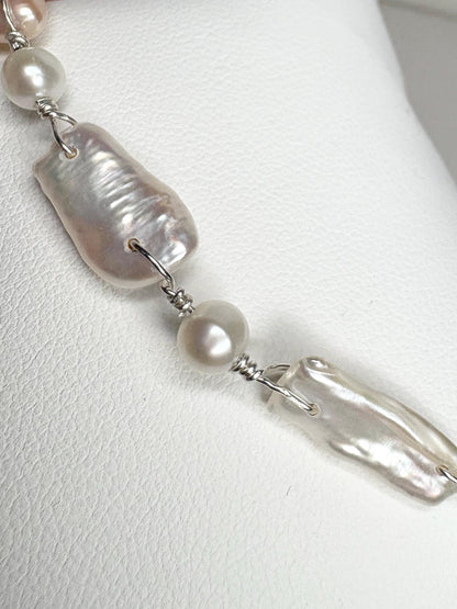 Sterling silver bracelet with white and peach Biwa freshwater pearls.
