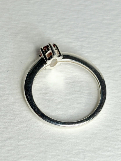 Sterling silver ring with a faceted peach Oregon sunstone.