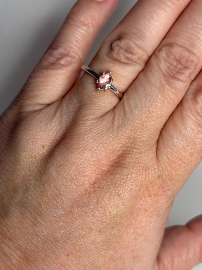 Sterling silver ring with a peach checkerboard faceted Oregon Sunstone.