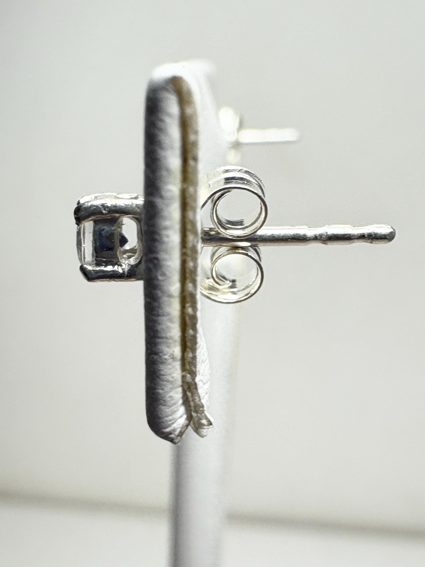 Sterling silver stud earrings with 3mm blue sheen moonstone gems.