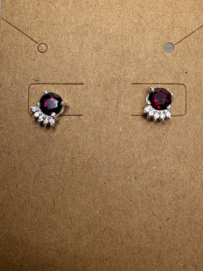 Arizona Anthill garnet and zircon stud earrings in sterling silver.
