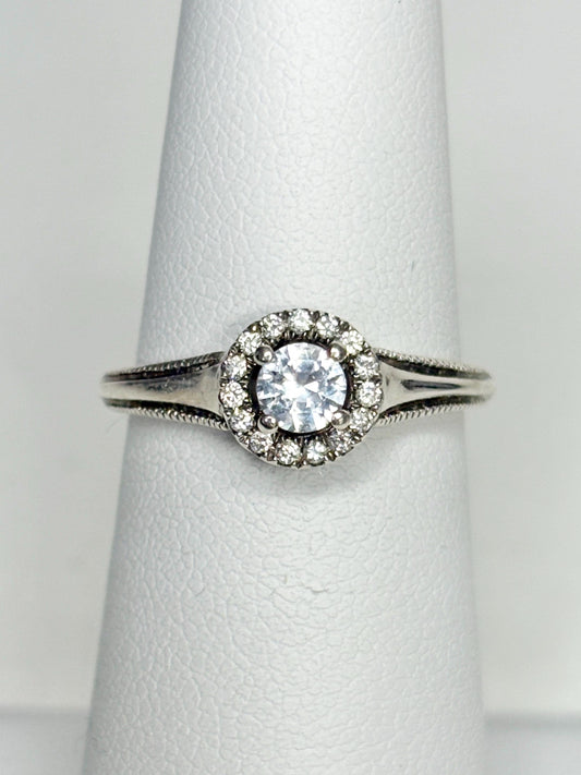 Sterling silver ring with white sapphire and diamond halo.