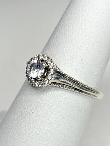 Sterling silver ring with a white sapphire and diamond halo.