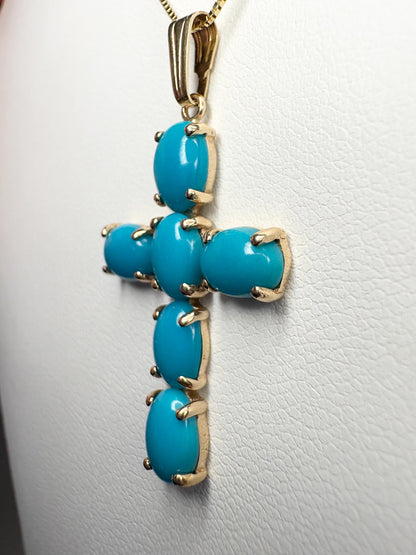 14k gold cross pendant necklace with six oval Sleeping Beauty turquoise stones.