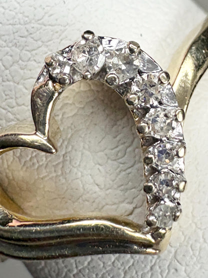 A 10k yellow gold heart ring with eight natural diamonds.