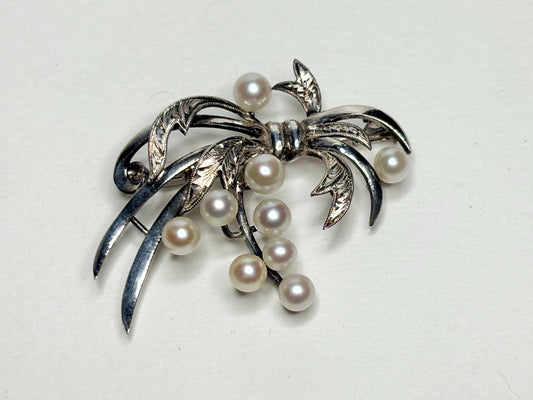 Vintage sterling silver bow brooch with 9 Akoya cultured pearls.