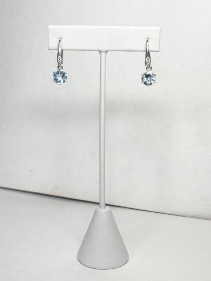 Sterling silver dangle earrings with blue topaz and zircon.