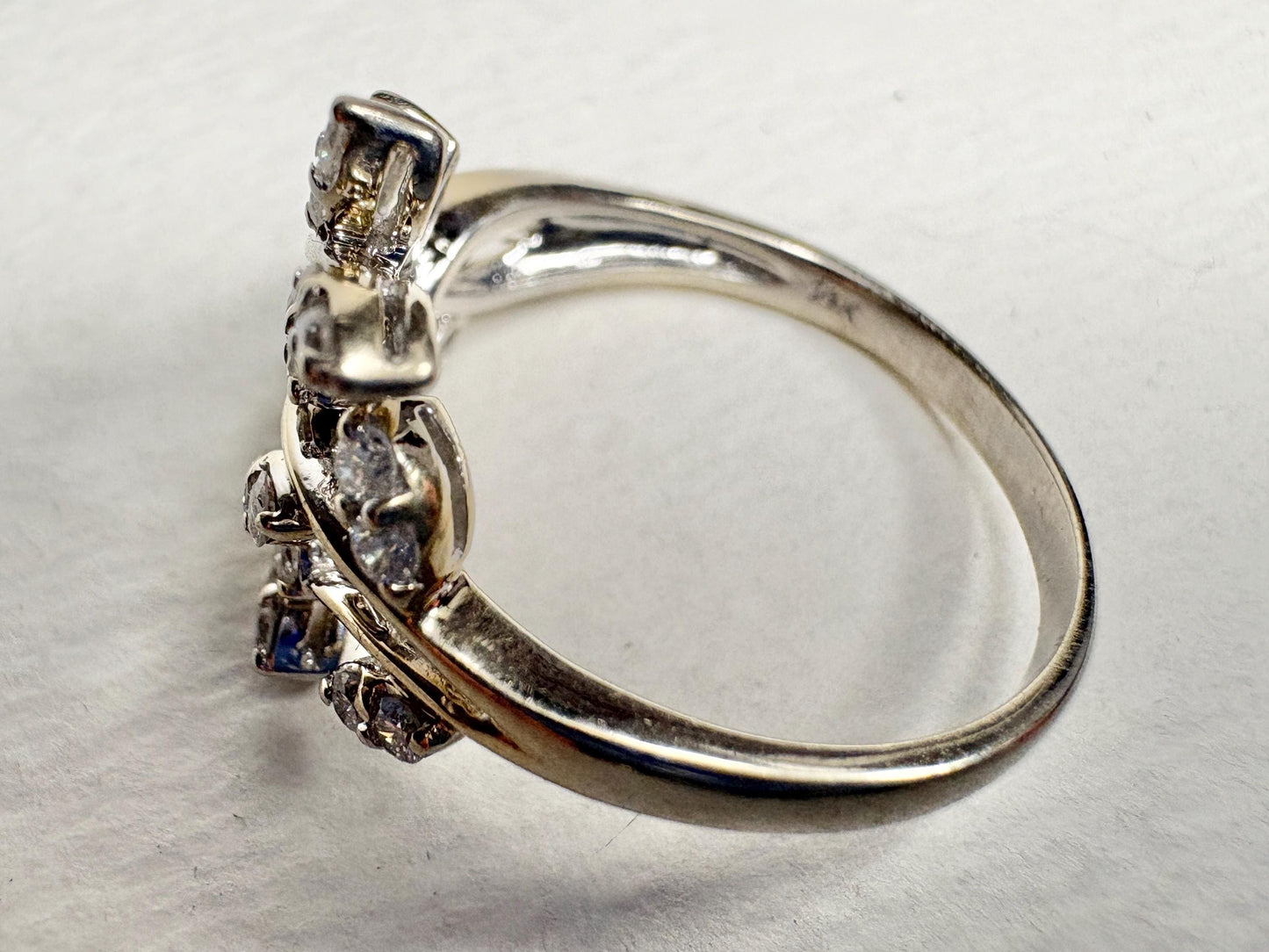 A 14k white gold ring with 1/2ct diamonds in a vine style.
