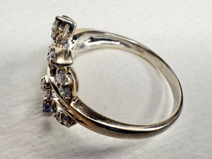 A 14k white gold ring with 1/2ct diamonds in a vine style.