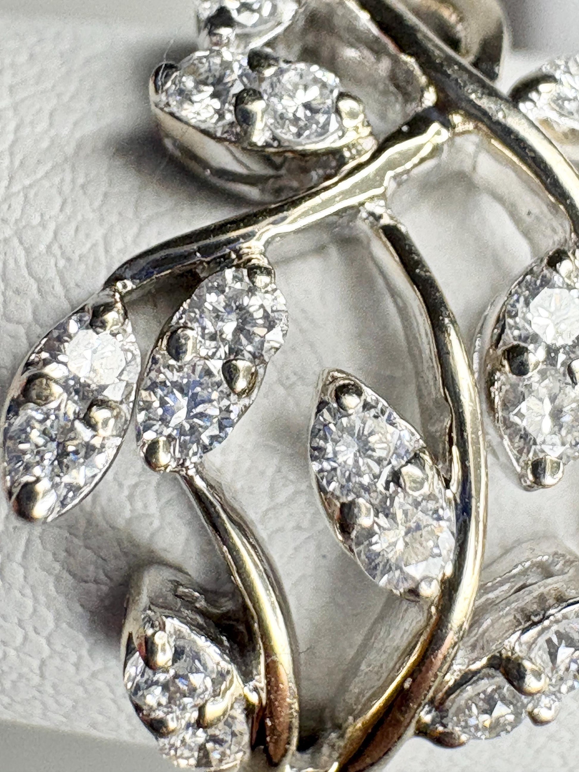 Vine style ring with diamonds in 14k white gold.