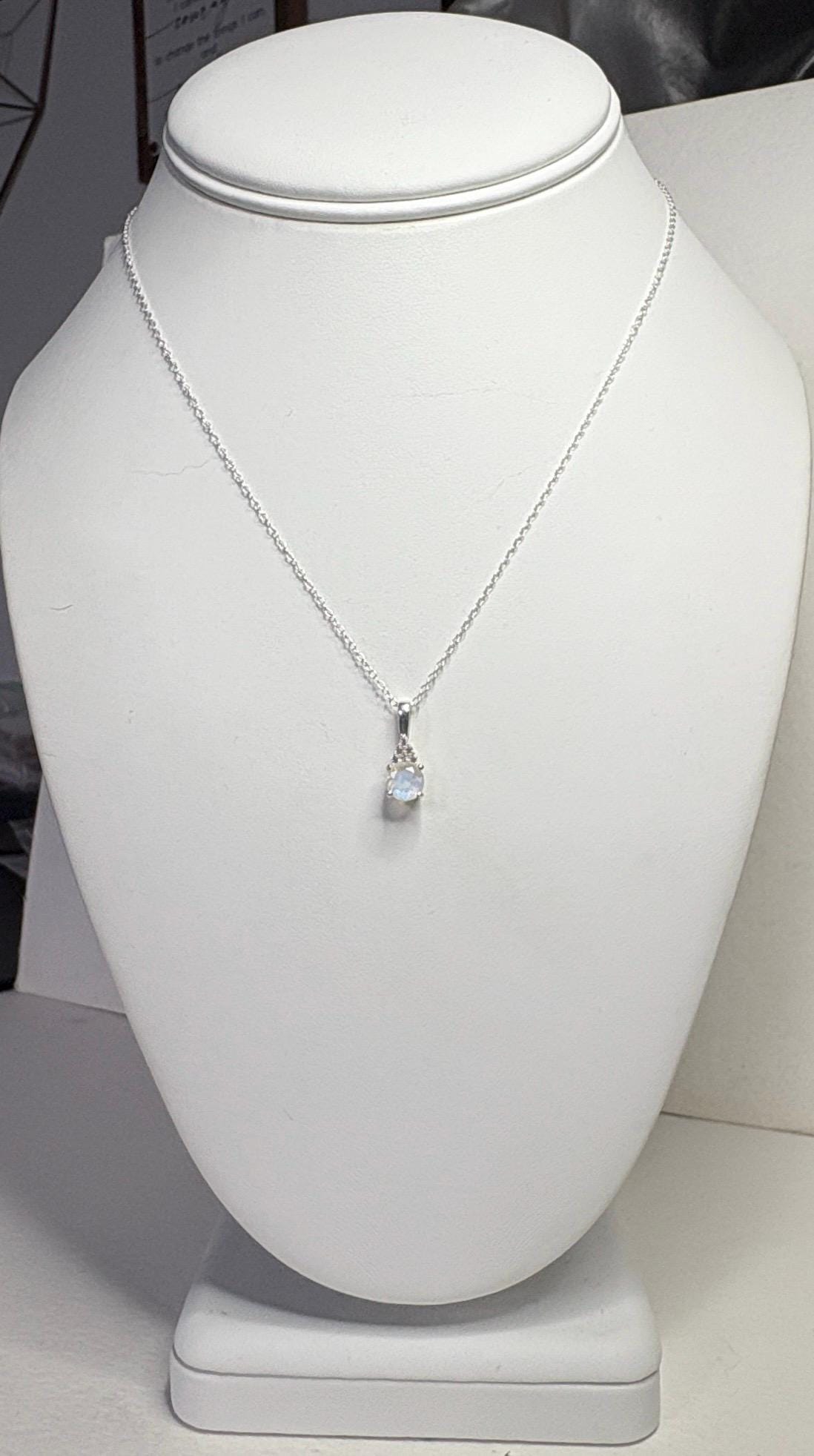 Sterling silver necklace with rainbow moonstone and zircon pendant.