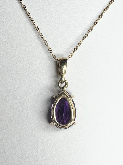 14k gold necklace with a pear-shaped amethyst pendant.