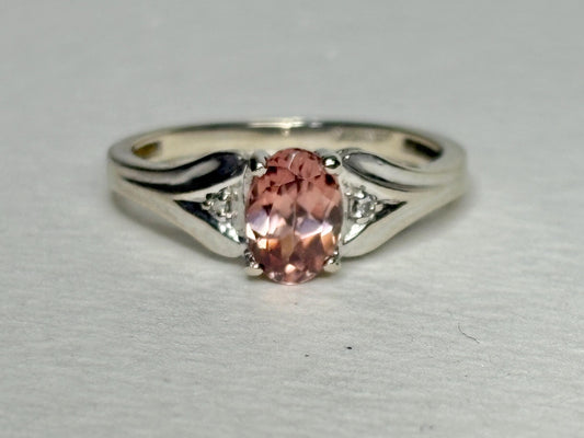 10k white gold ring with a blush pink zircon and diamond accents.