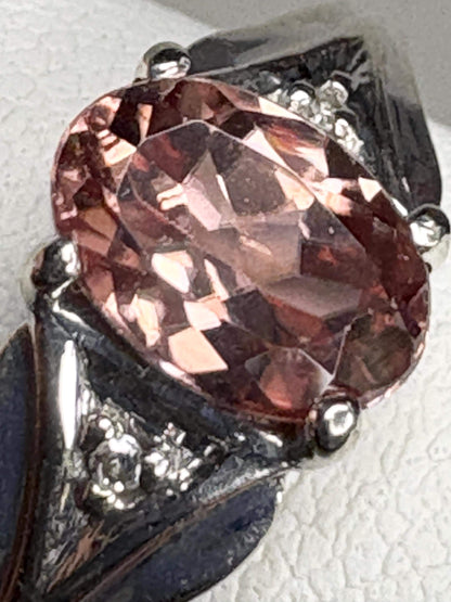 Ring with blush pink zircon and diamond accents in white gold.