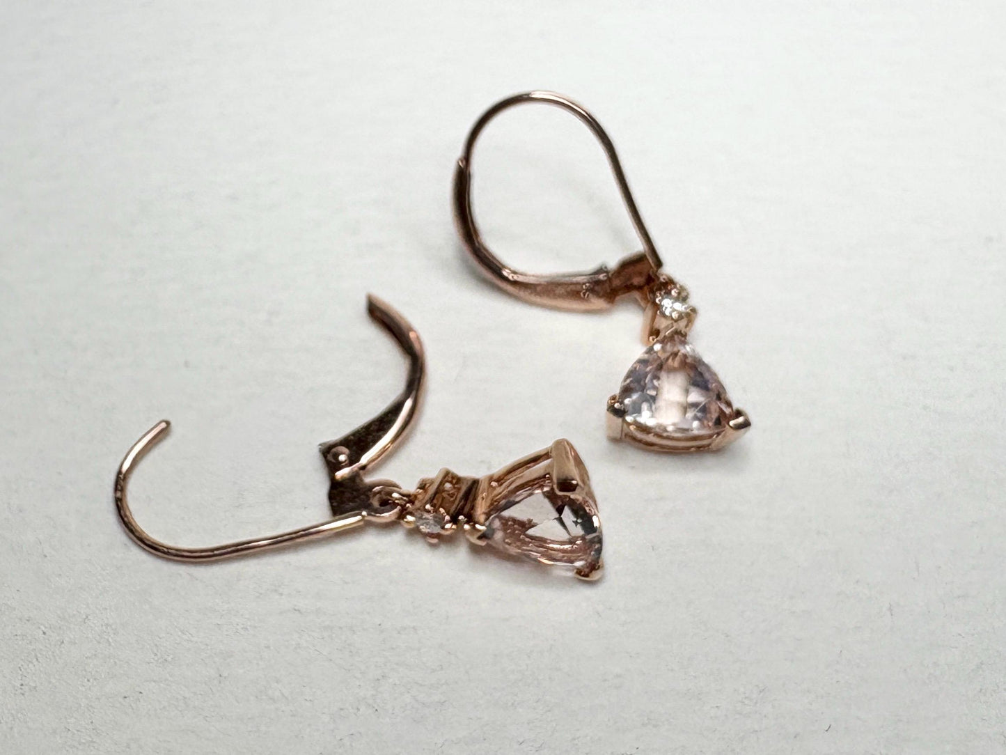 Rose gold dangle earrings with trillion morganite and diamond accents.