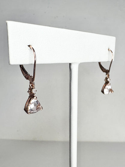 Rose gold dangle earrings with trillion morganite and diamond accents.