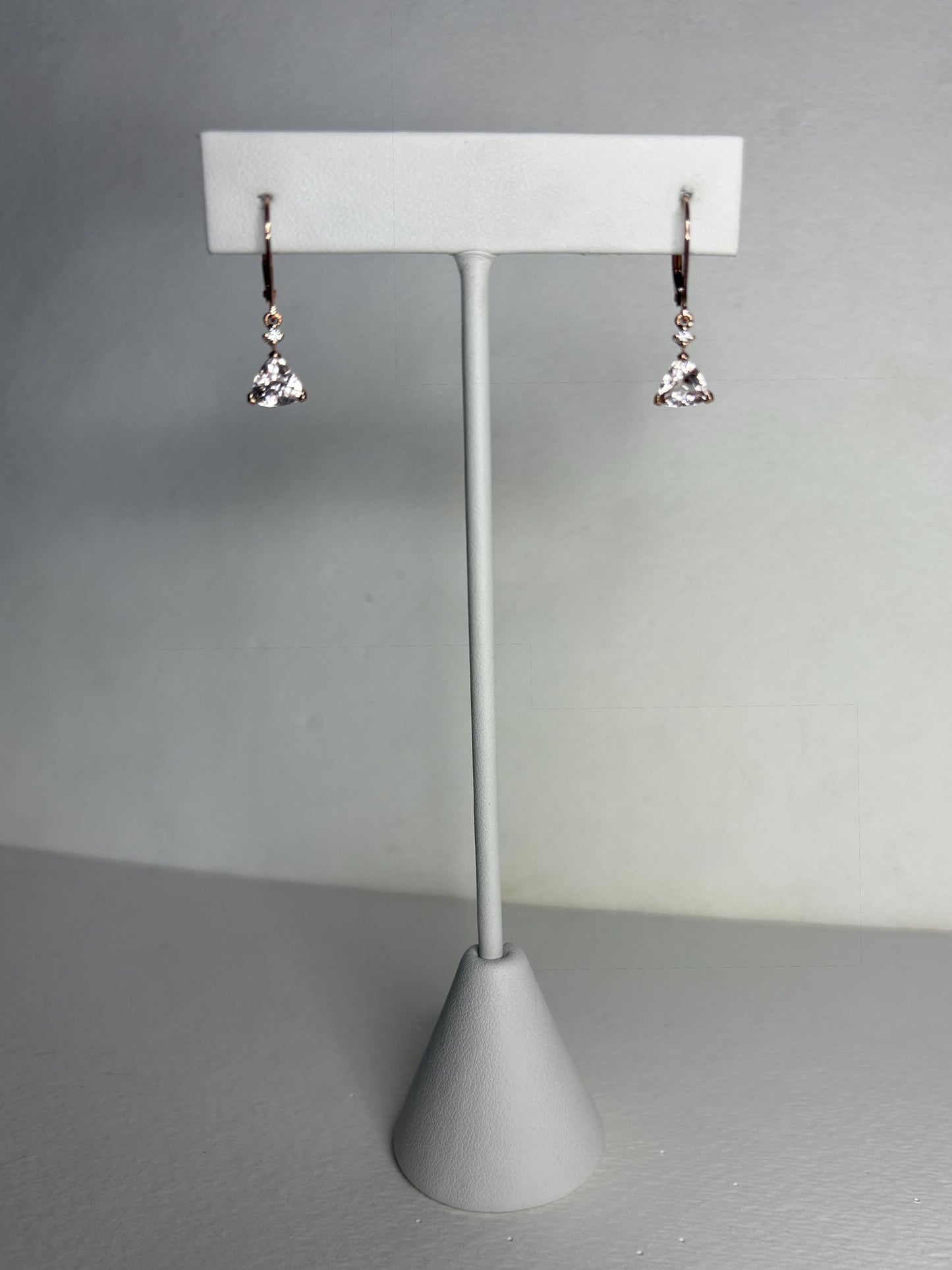 Rose gold dangle earrings with trillion morganite and diamond accents.