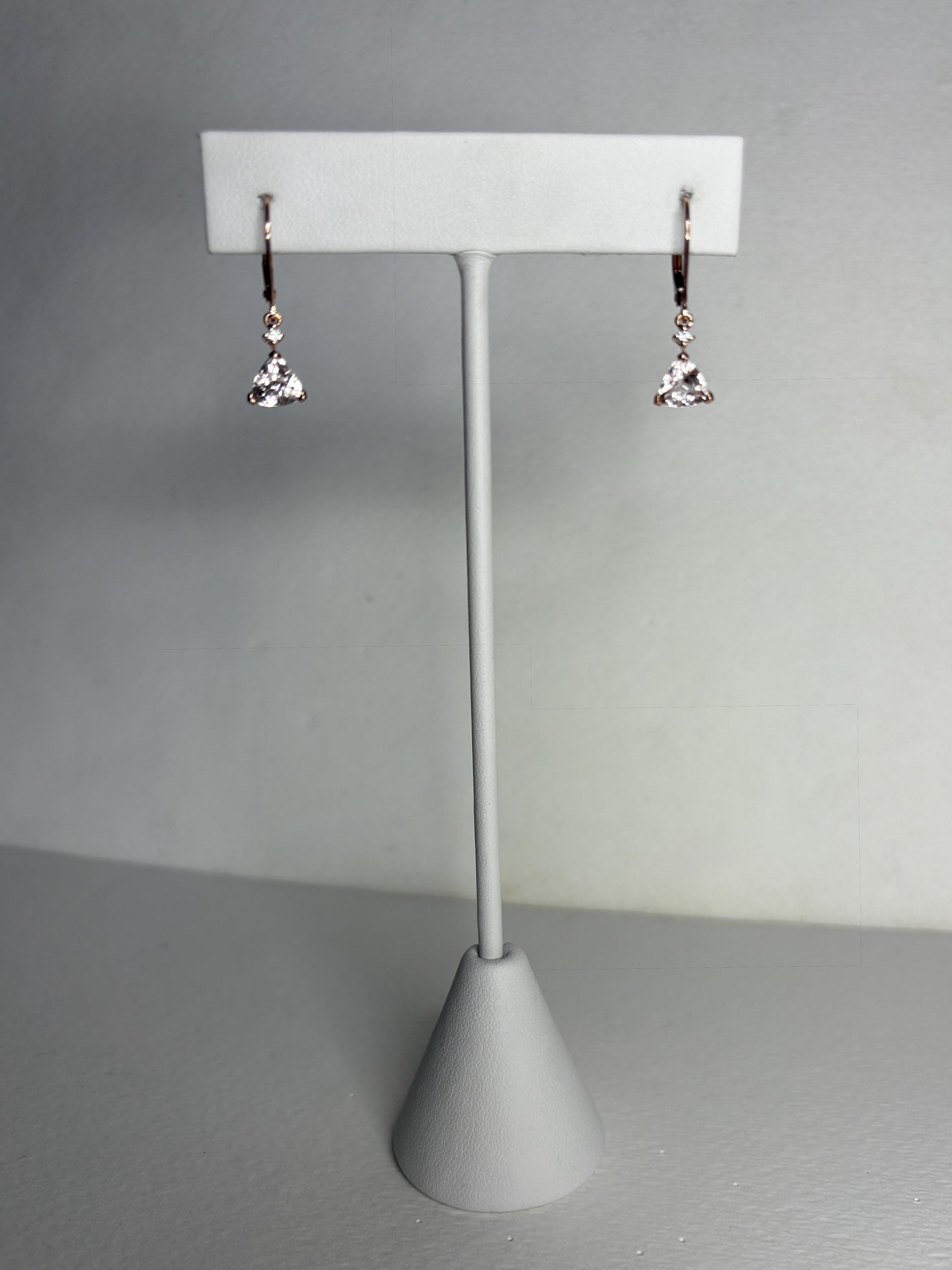 Rose gold dangle earrings with trillion morganite and diamond accents.