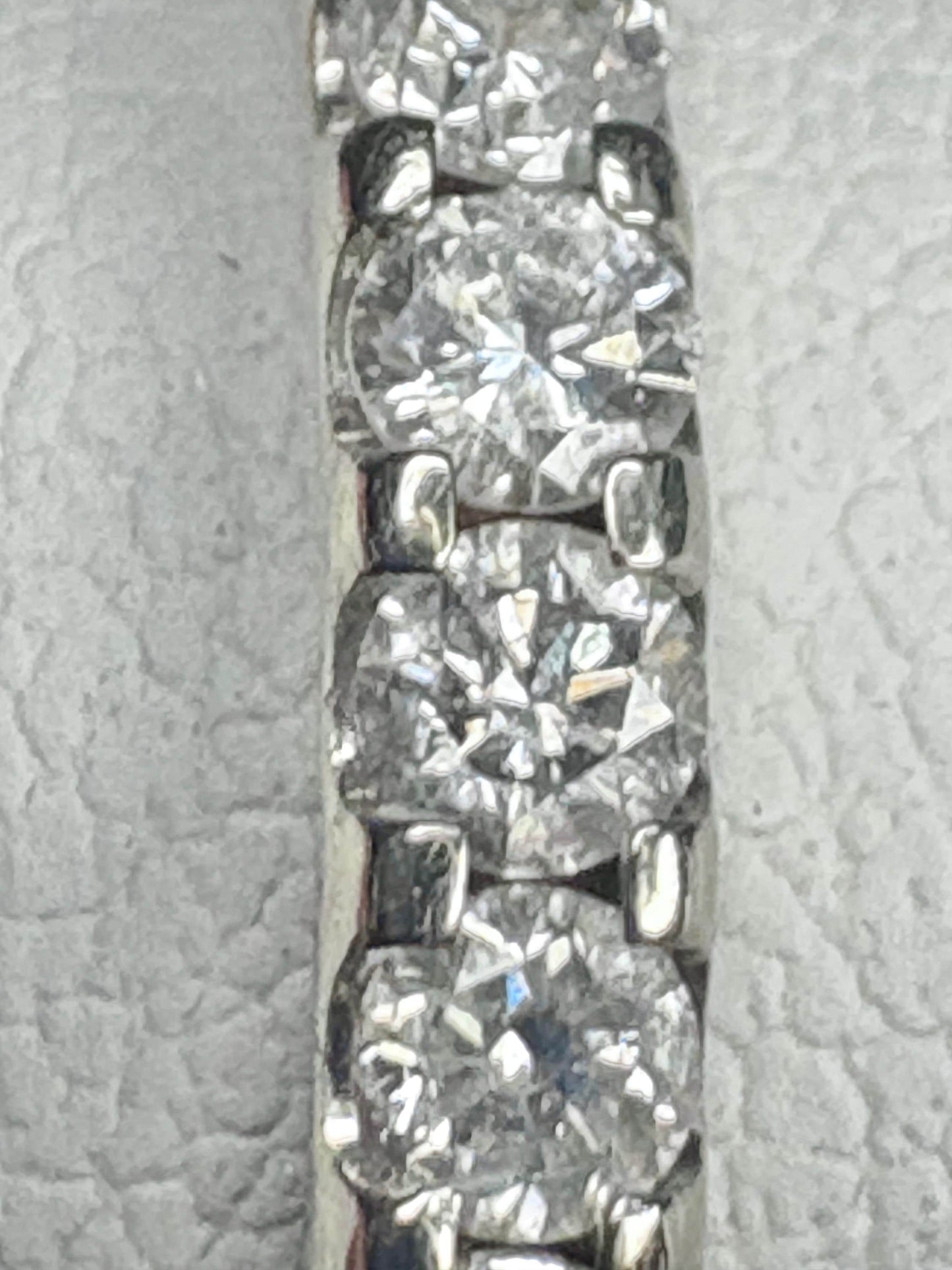 A 14k white gold full eternity band with 28 natural diamonds.