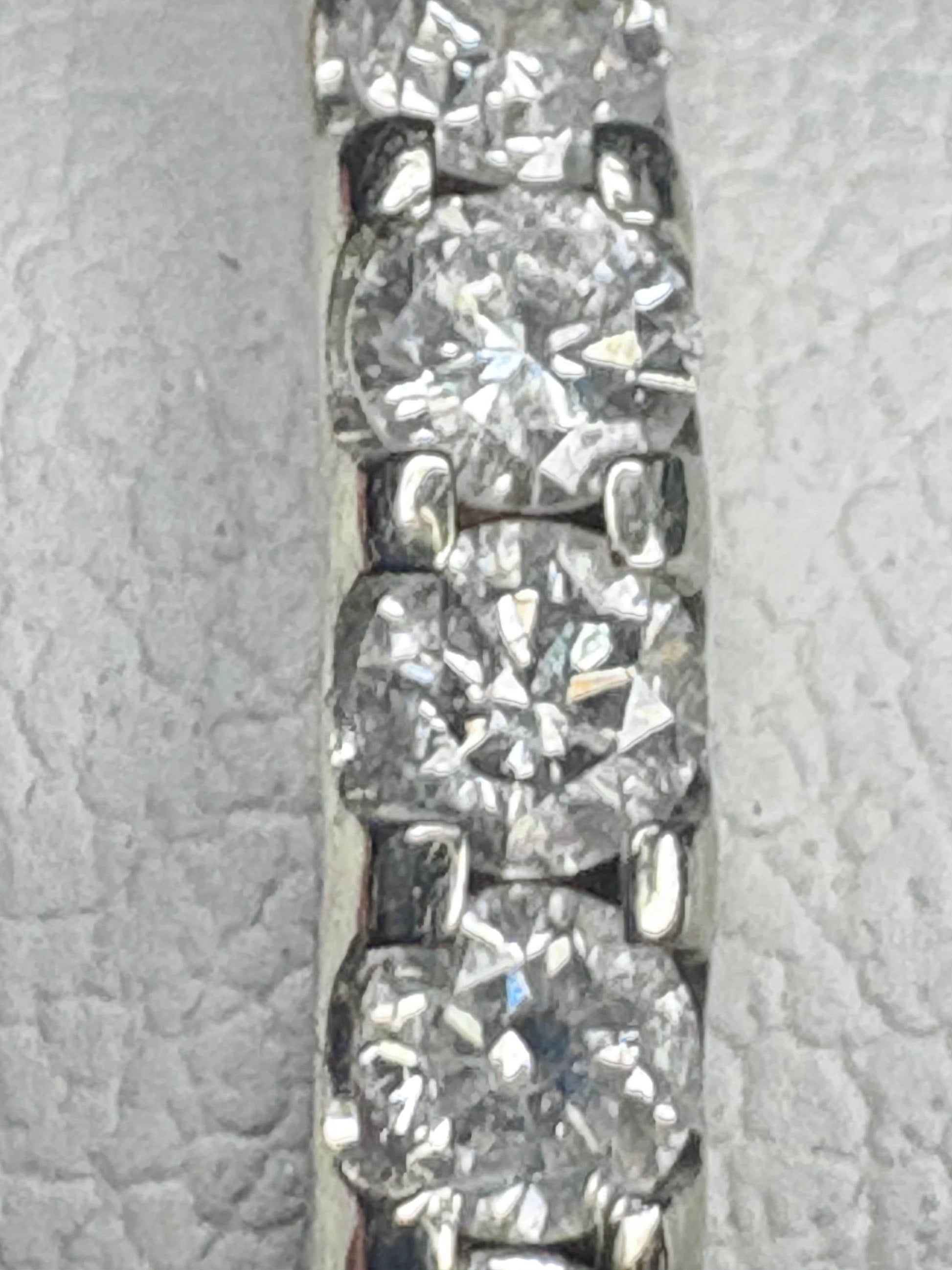 A 14k white gold full eternity band with 28 natural diamonds.