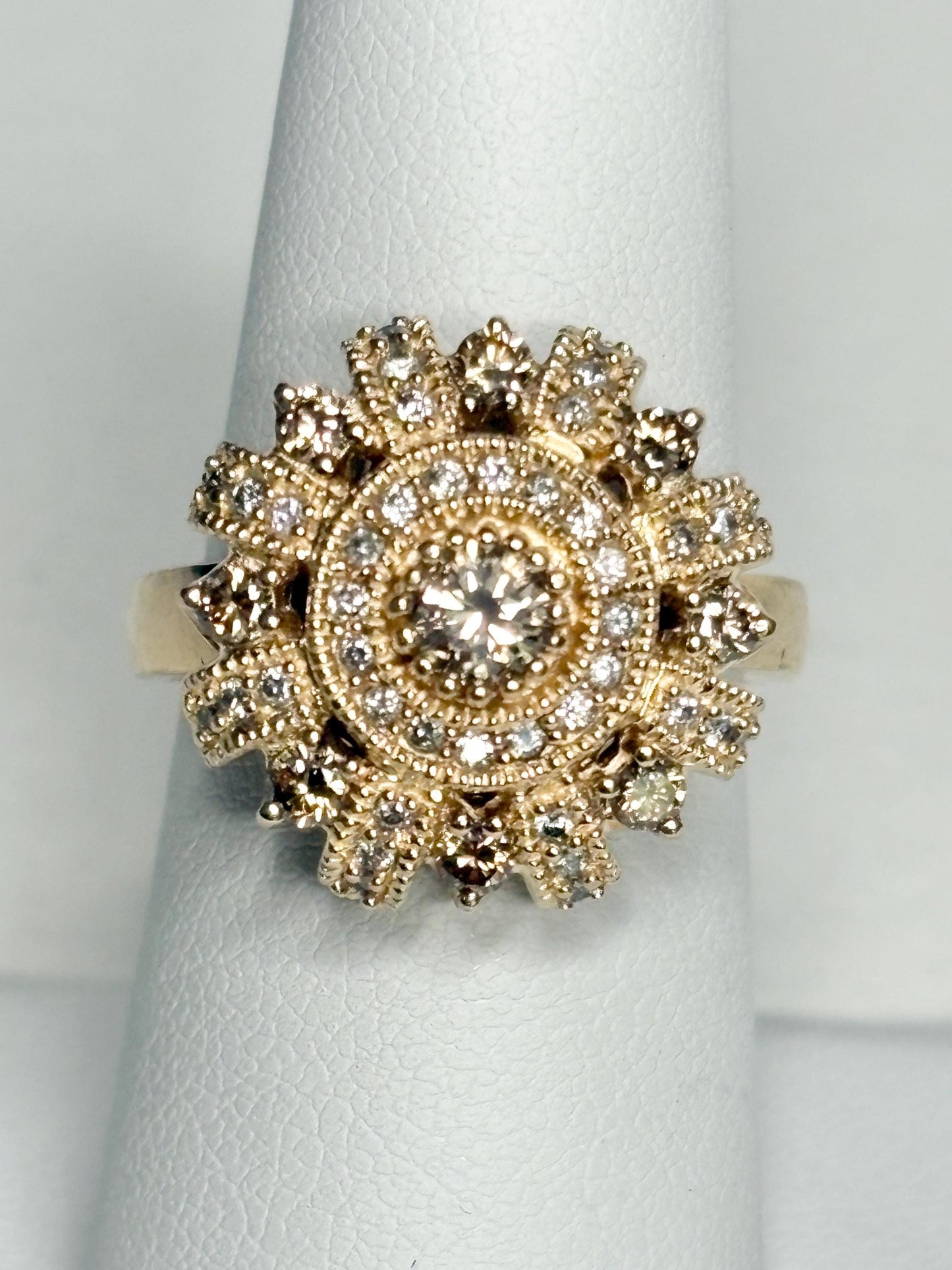 Bold 14k gold ring with champagne diamonds in a sunburst design.