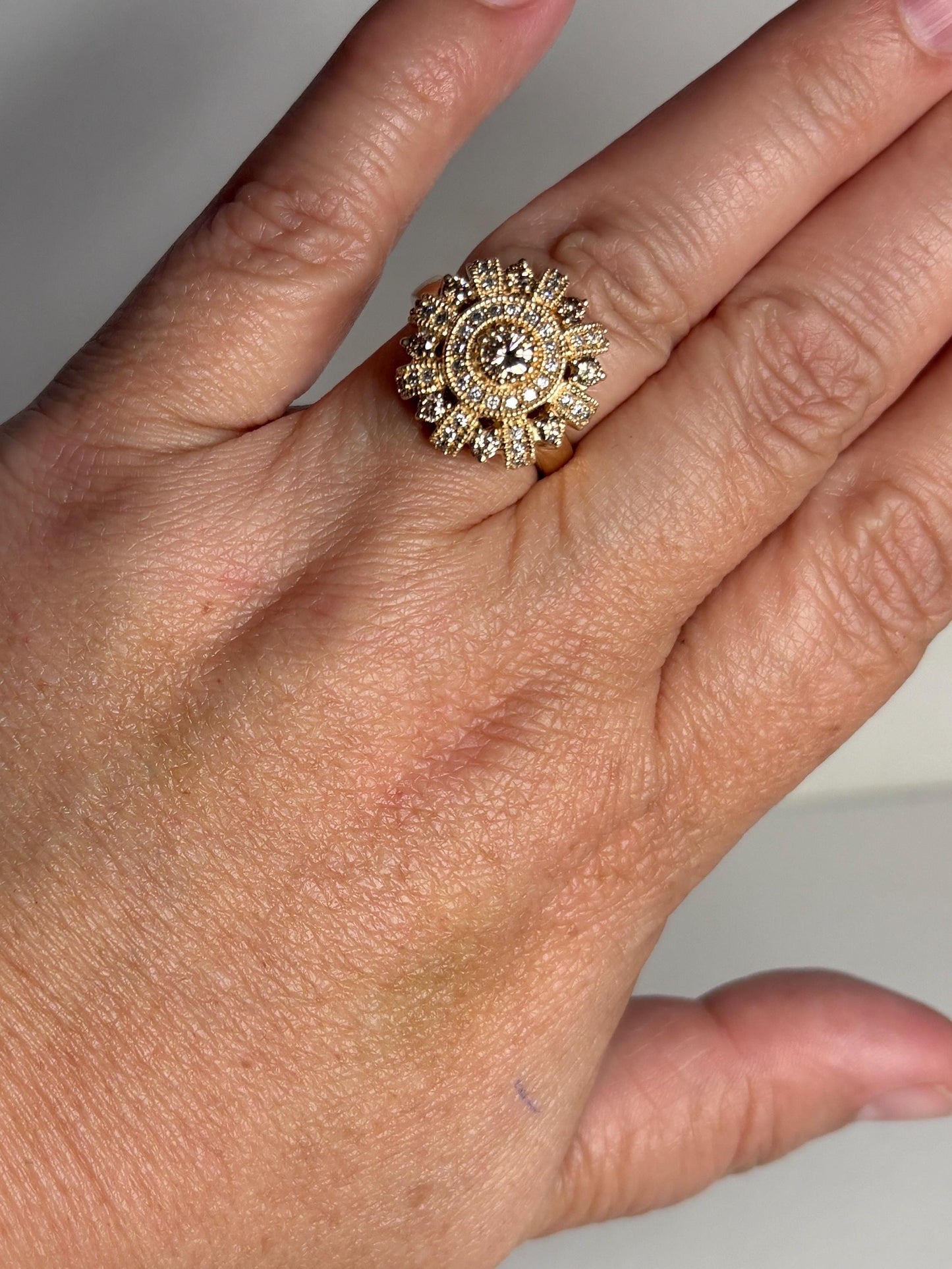 Bold 14k gold sunburst ring with champagne diamonds.