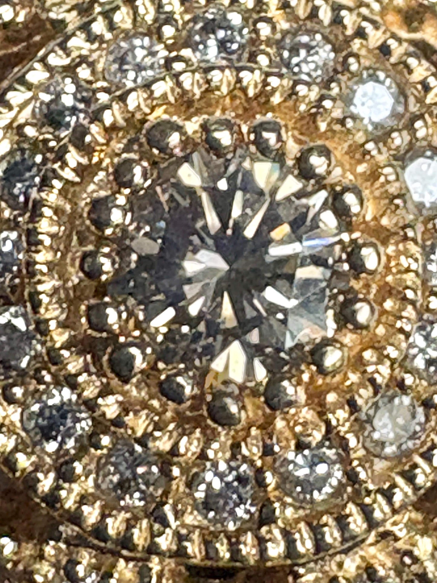 A bold 14k gold ring with a champagne diamond sunburst design.