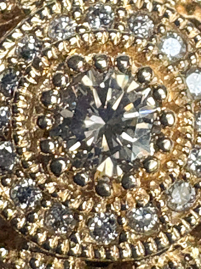 A bold 14k gold ring with a champagne diamond sunburst design.