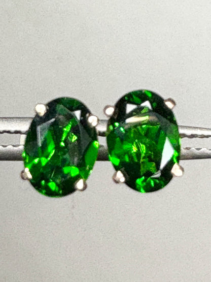 Pair of oval chrome diopside stud earrings in 14k gold.
