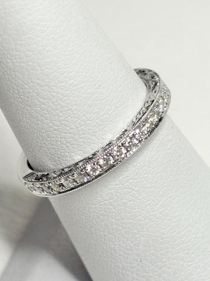 14k white gold band with diamonds and etched detailing.