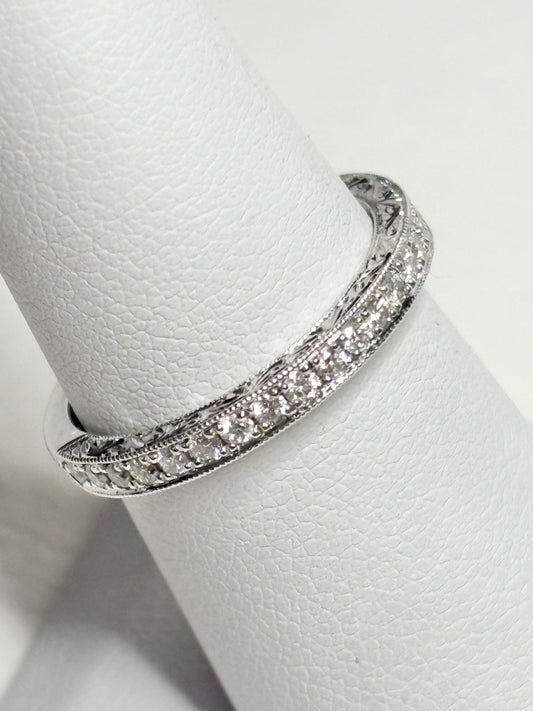 14k white gold band with diamonds and etched detailing.