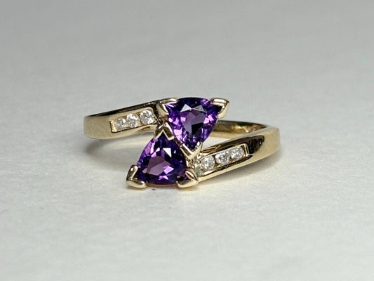 Amethyst trillion bypass ring with diamonds in solid 10k gold.