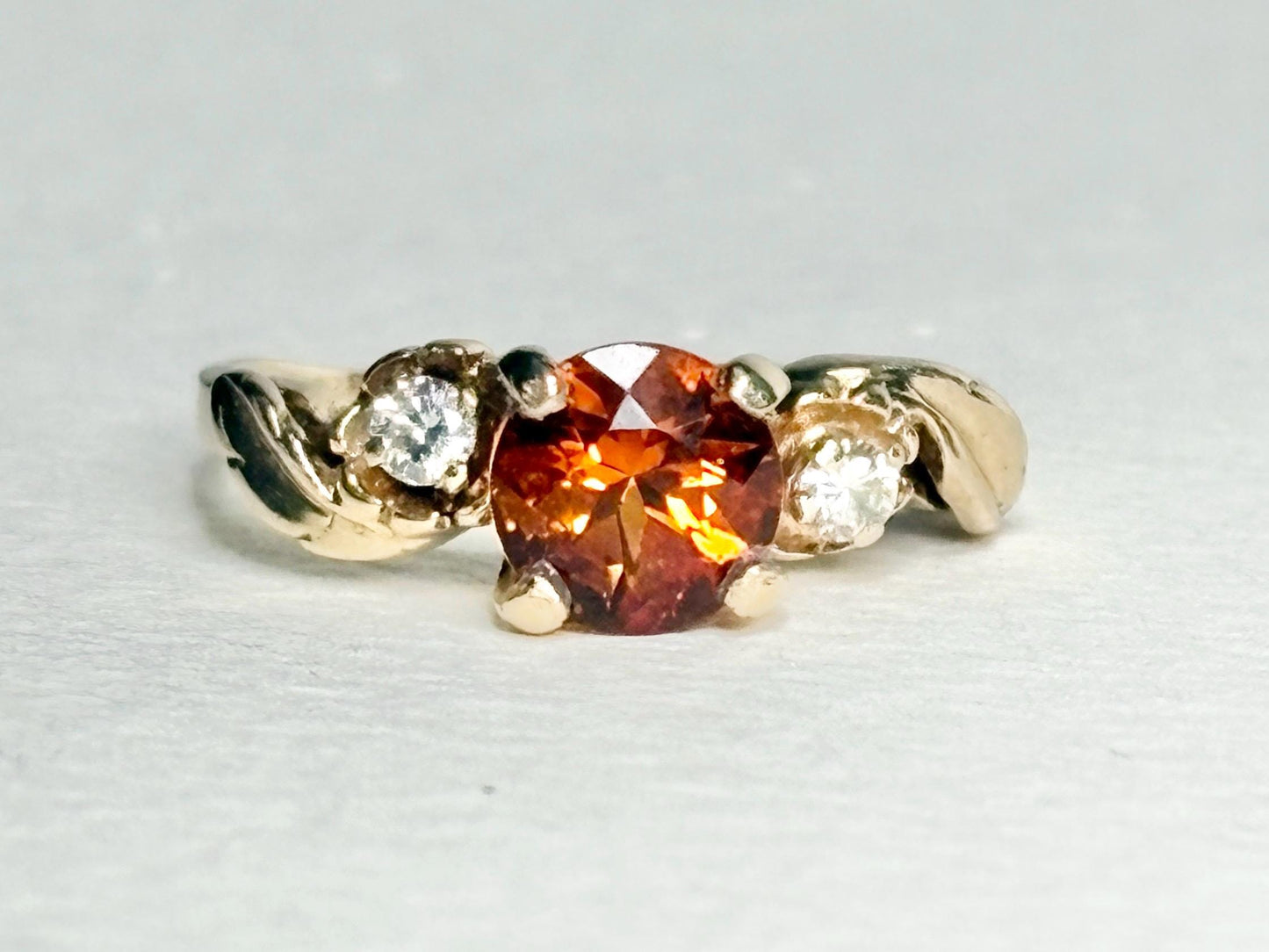 14k gold ring with Madeira citrine and diamonds in a floral design.