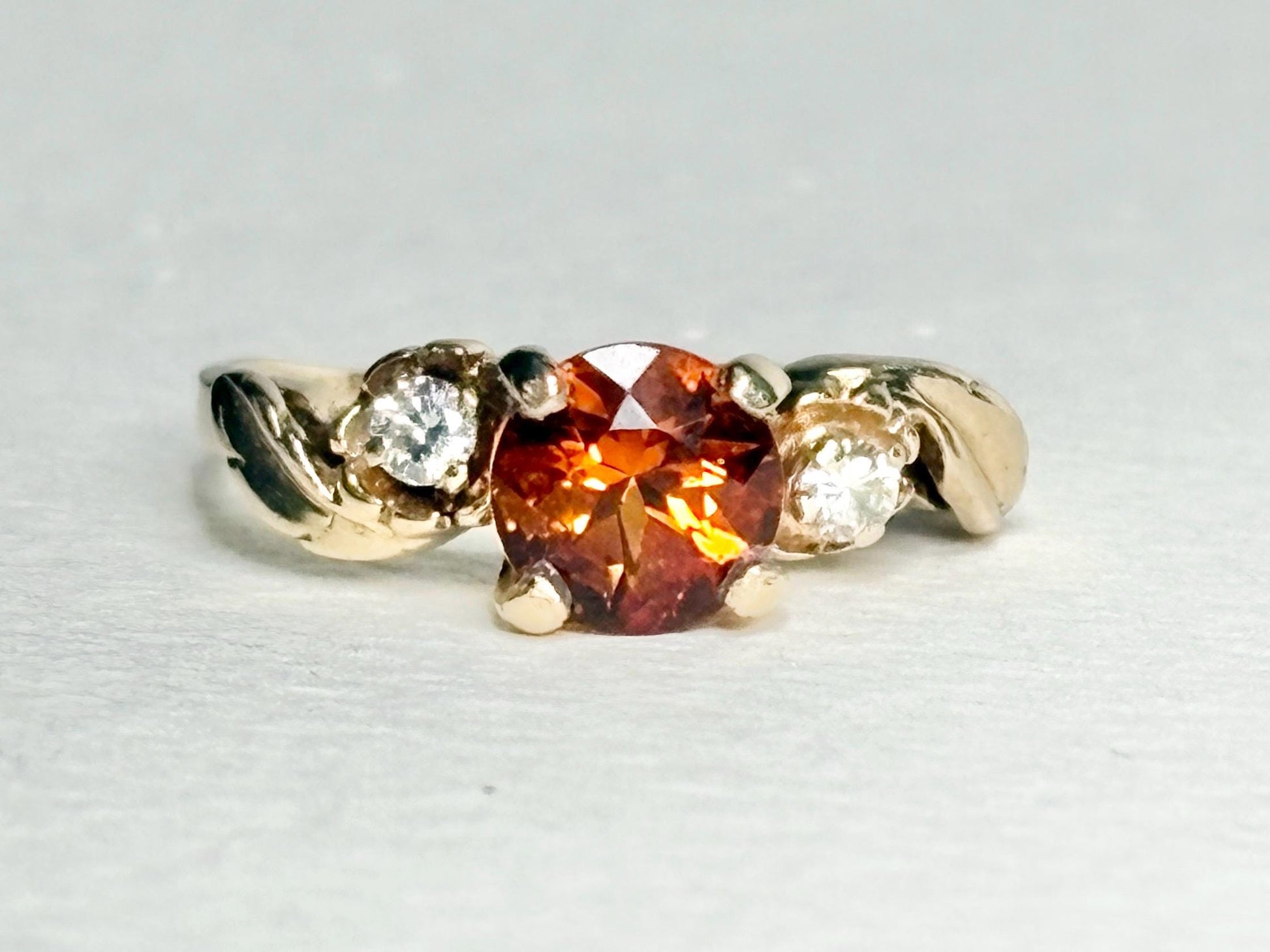 14k gold ring with Madeira citrine and diamonds in a floral design.