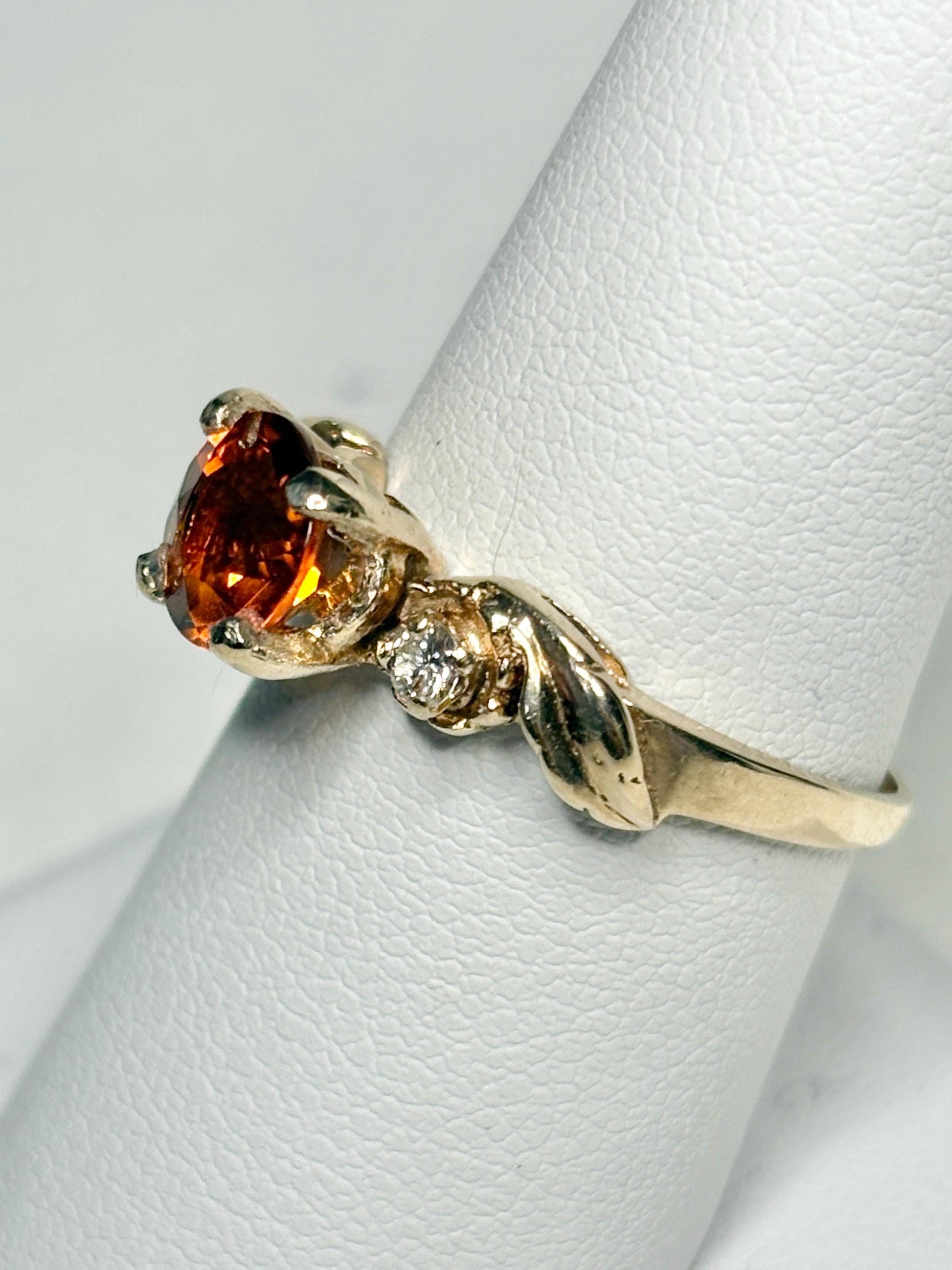 14k gold ring with a Madeira citrine and diamonds in a floral design.