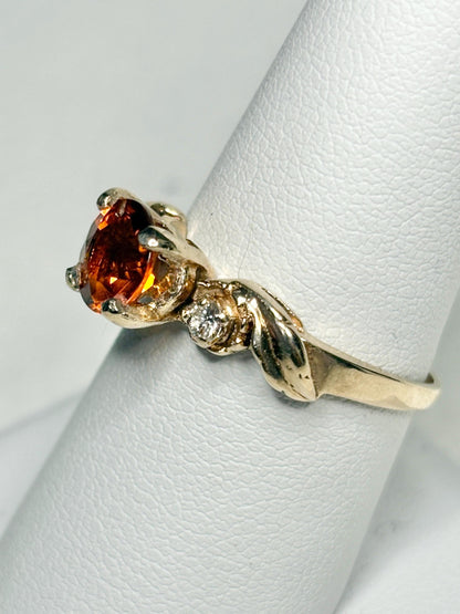 14k gold ring with a Madeira citrine and diamonds in a floral design.