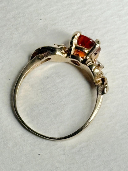 14k gold ring with Madeira citrine and diamonds in a floral design.