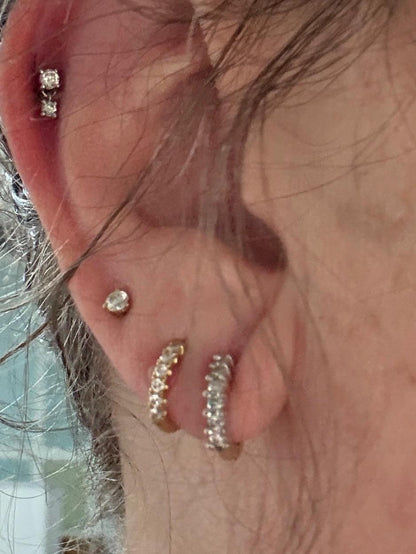 Tiny partial stud hoop natural diamond earrings in solid 14k gold.