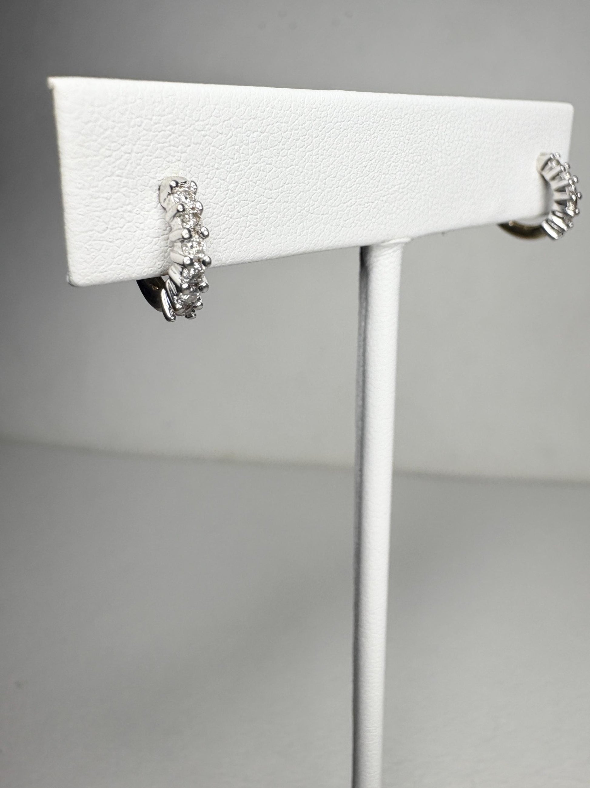 Tiny 14k gold hoop earrings with natural diamonds.