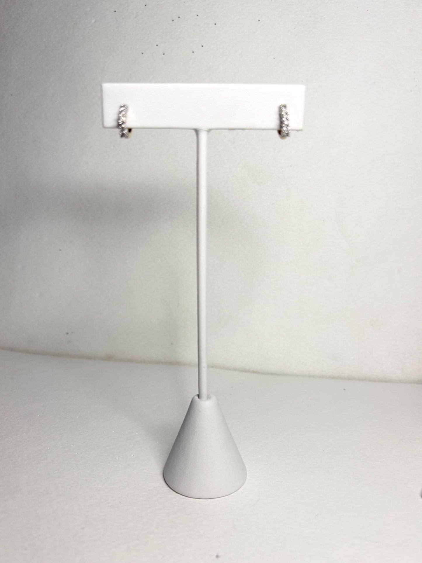 Tiny partial stud hoop earrings with natural diamonds in 14k gold.