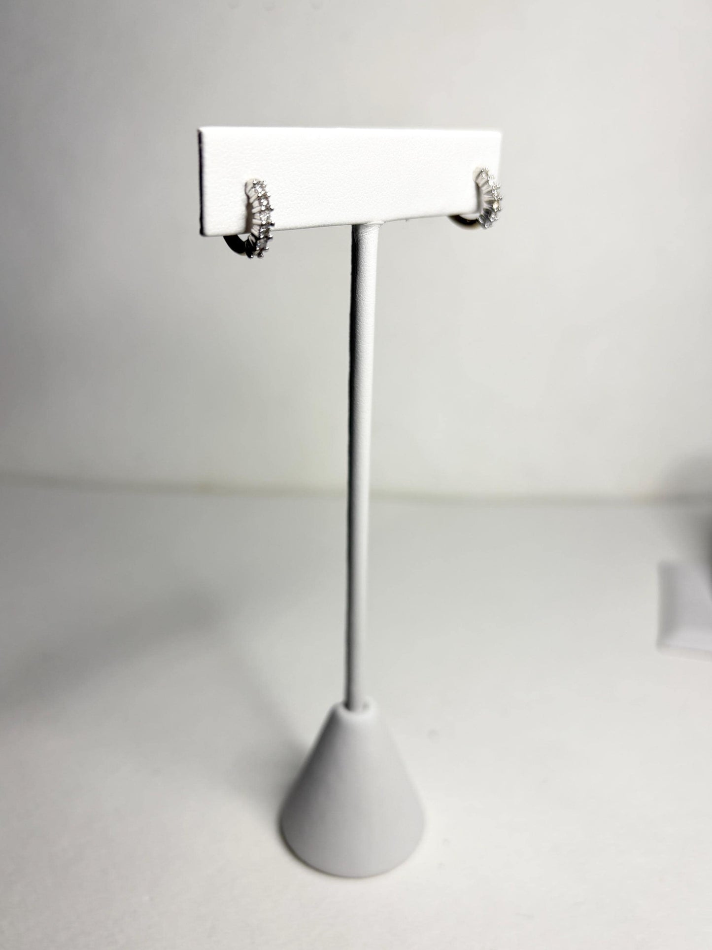 Tiny partial stud hoop earrings with natural diamonds in solid 14k gold.