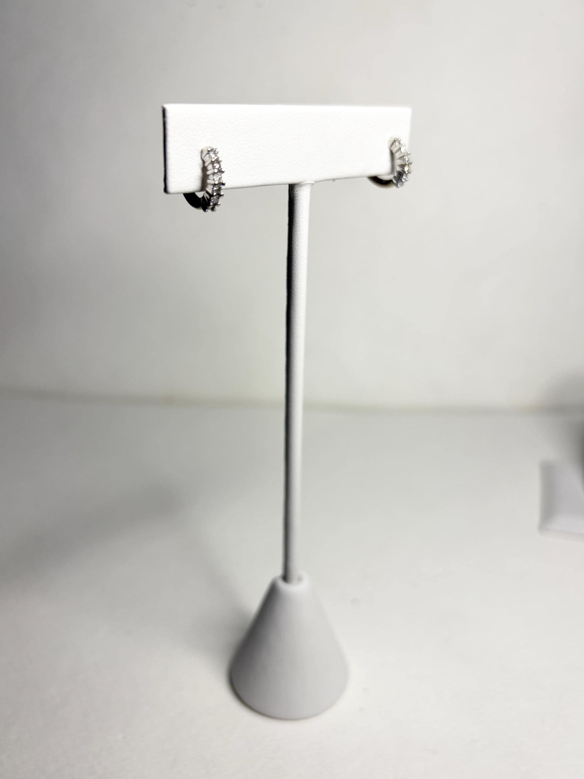 Tiny partial stud hoop earrings with natural diamonds in solid 14k gold.