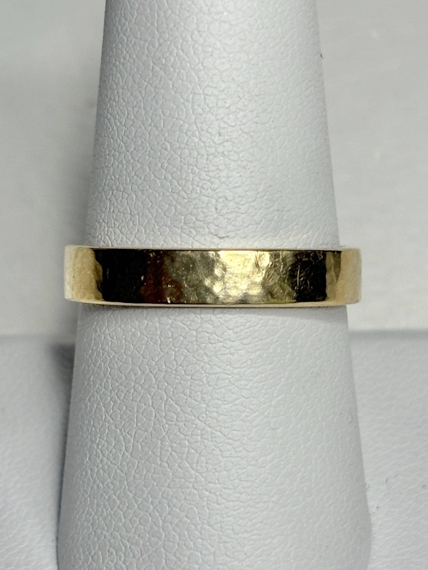 Solid 18k yellow gold hammered finish square band ring.