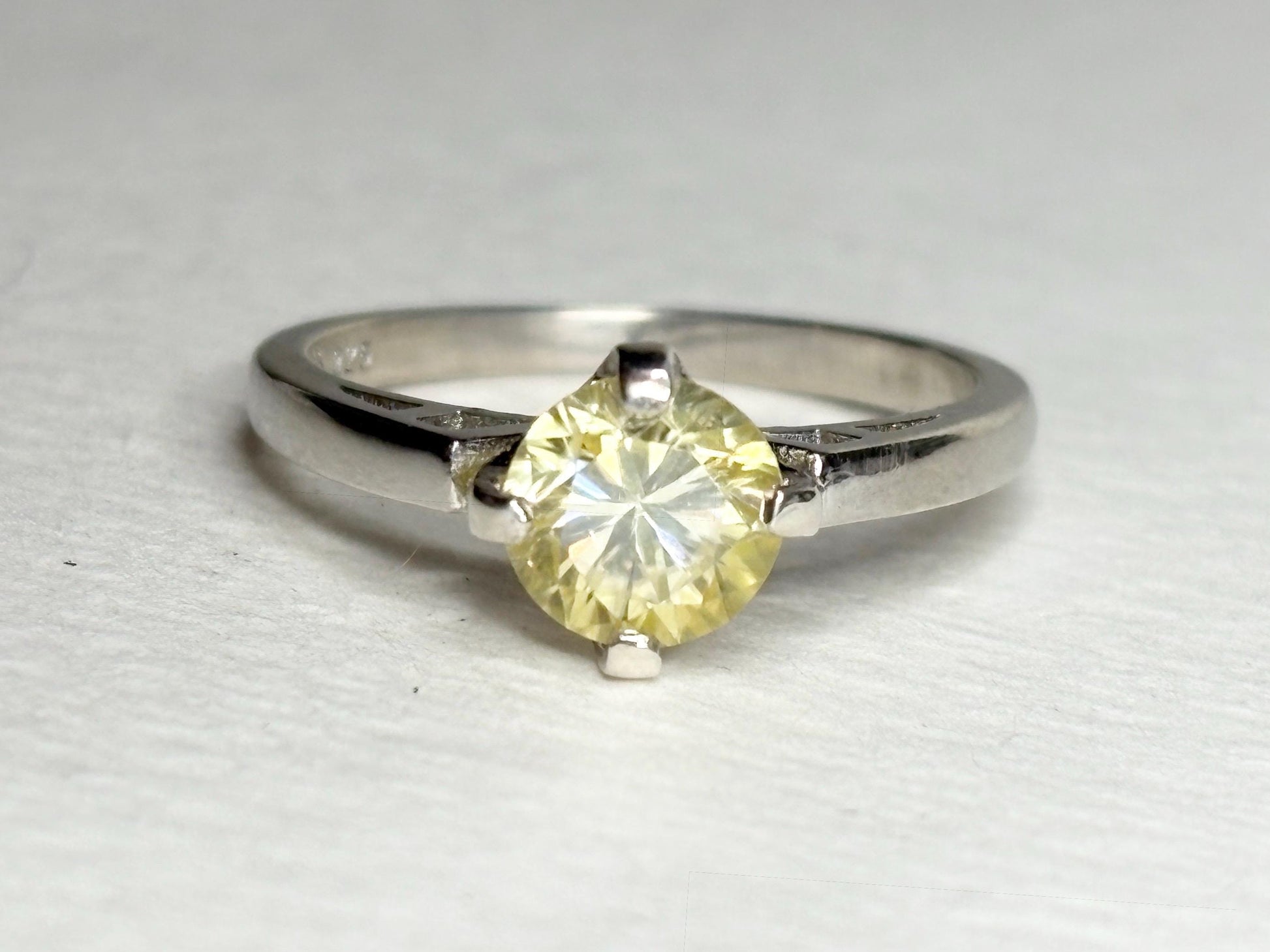 Sterling silver ring with a yellow moissanite solitaire, size 7.